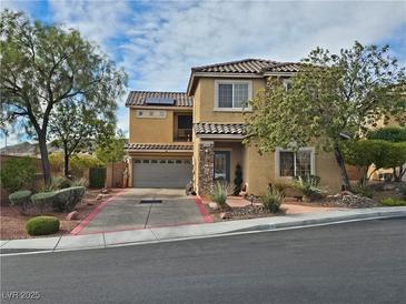 Charming two-story home with well-maintained landscaping and inviting curb appeal in a desirable neighborhood at 2691 Benton Cove St, Laughlin, NV 89029