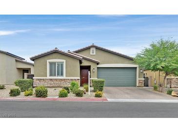 Charming single-story home featuring a two-car garage and well-manicured landscaping at 7224 Anora St, North Las Vegas, NV 89084