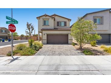 Charming two-story home with a brick driveway and well-maintained landscaping at 8261 Selenite St, Las Vegas, NV 89113