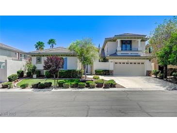 Charming two-story home featuring a well-manicured lawn and a two car garage at 10249 Wisteria Hills Ct, Las Vegas, NV 89135