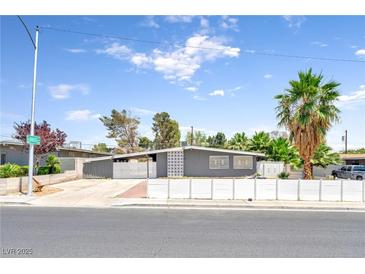 Charming single-story home featuring a desert landscape and a long driveway at 1713 E Bonanza Rd, Las Vegas, NV 89101
