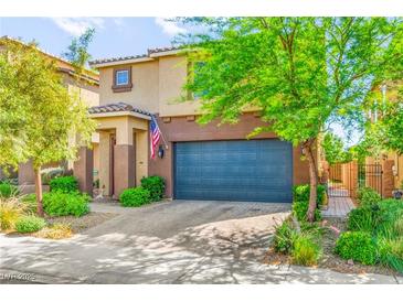Charming two-story home featuring a two-car garage, landscaped front yard, and a cozy covered entry at 2333 Mundare Dr, Henderson, NV 89002
