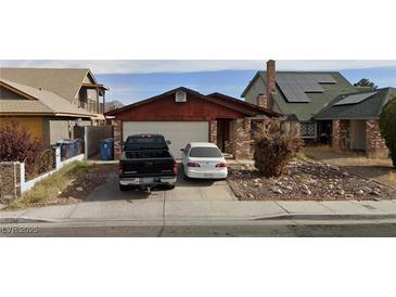 Cozy single-story home featuring a two-car garage and low maintenance landscaping at 653 Lineshack Ln, Las Vegas, NV 89110