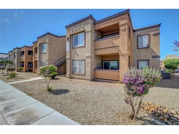 Two-story apartment complex features desert landscaping and private balconies at 6650 W Warm Springs Rd # 1083, Las Vegas, NV 89118