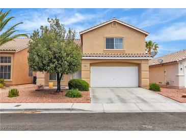 Charming two-story home featuring a tile roof, a spacious two-car garage, and mature landscaping at 682 E Sole Addiction Ave, Las Vegas, NV 89183