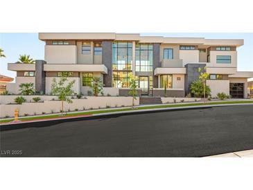 Stunning modern home with a multi-level facade, beautiful landscaping, and large windows at 2695 Ponte Vecchio Ter, Henderson, NV 89052