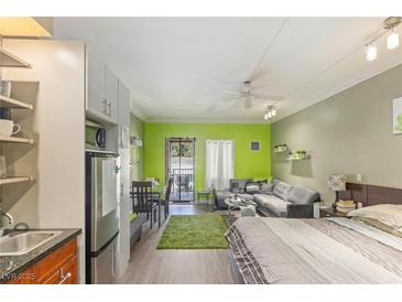 Bright open floor plan featuring dining, living, and sleeping areas with a private balcony at 30 Strada Di Villaggio # 429, Henderson, NV 89011