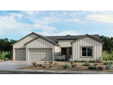 Beautiful single-story home showcasing a three-car garage and low-maintenance landscaping at 489 Carter House Way, Las Vegas, NV 89138