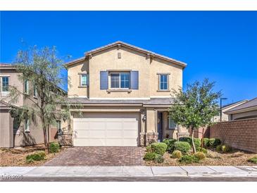 Charming two-story home with a well-manicured front yard and a two-car garage at 7045 Judith River St, North Las Vegas, NV 89084