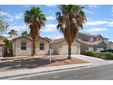 Charming single-story home featuring desert landscaping and a two-car garage at 908 Cypress Gold Ct, North Las Vegas, NV 89031