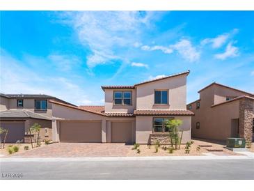 Charming two-story home featuring desert landscaping and a convenient three-car garage at 9314 Observatory St, Las Vegas, NV 89143