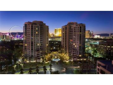Stunning nighttime aerial view of the luxury high rise condos with city and High Roller Observation Wheel views at 1 Hughes Center Dr # 308, Las Vegas, NV 89169