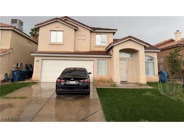 Charming two-story home featuring a two-car garage and well-maintained front yard at 1749 Green Apple Way, Las Vegas, NV 89142
