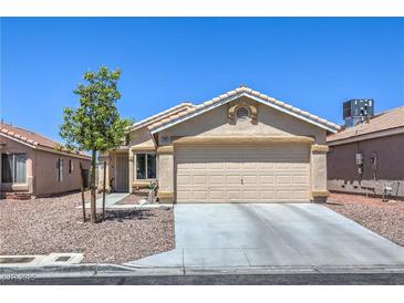 Charming single-story home featuring a two-car garage and low-maintenance desert landscaping at 2595 Amber Crest St, Las Vegas, NV 89142