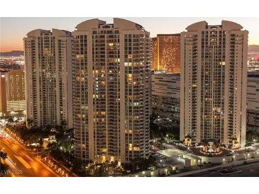 Striking view of the high-rise buildings with illuminated windows at dusk, creating a vibrant city scene at 2777 Paradise Rd # 1505, Las Vegas, NV 89109