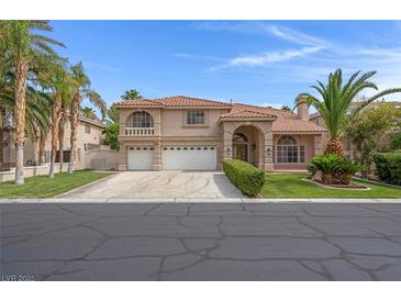 Charming two-story home with three-car garage, desert landscaping, and a terracotta roof at 1312 Fragrant Spruce Ave, Las Vegas, NV 89123
