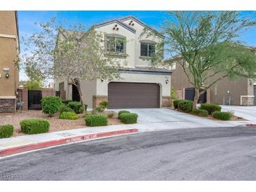 Charming two-story home features a well-kept lawn, desert landscaping, and attached garage at 3712 Gilmore Creek St, Las Vegas, NV 89129