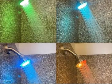 Unique shower head with colored led lights creating a spa-like experience at home at 4421 Alexis Dr # 429, Las Vegas, NV 89103