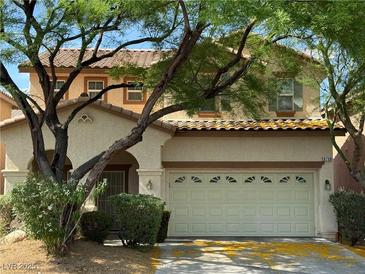 Charming two-story home with a well-maintained front yard and two car garage at 8708 Gateway Glen Dr, Las Vegas, NV 89178