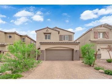 Charming two-story home with brick driveway and well-maintained landscaping at 872 Pointe Arbor St, Henderson, NV 89011
