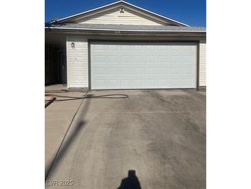 Attached two car garage providing convenient parking and additional storage options at 105 Huntly Rd, Las Vegas, NV 89145