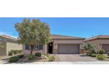 Charming single-story home with a two-car garage, desert landscaping and inviting curb appeal at 1120 Via Della Curia, Henderson, NV 89011