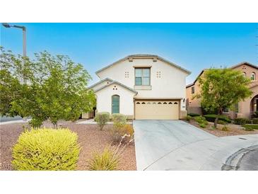 Charming two-story home featuring a two car garage and well-manicured landscaping at 11204 Newbury Hills Ave, Las Vegas, NV 89138
