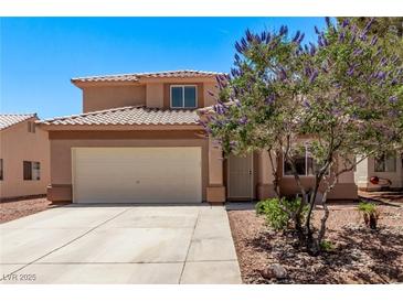 Inviting two-story home with a well-maintained yard and a two-car garage, perfect for suburban living at 2037 Merano Ct, Las Vegas, NV 89123