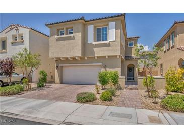 Charming two-story home featuring a two-car garage, stucco exterior, and well-maintained landscaping at 8055 Tank Loop St, Las Vegas, NV 89166