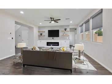 Bright and airy living room featuring a modern fireplace and stylish decor at 10270 Turkish Pine Ct, Las Vegas, NV 89166