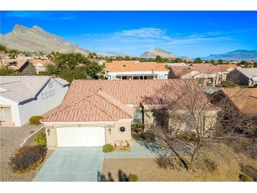 Inviting single-story home with tile roof and mountain views at 10628 Mission Lakes Ave, Las Vegas, NV 89134