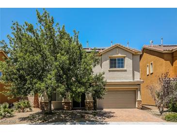 Charming two-story home with a well-manicured lawn and a two-car garage at 3820 Alpine Track Ave, North Las Vegas, NV 89032