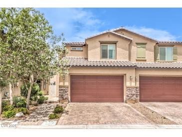 Charming townhome with a two-car garage and manicured front yard at 4212 Juanita May Ave, North Las Vegas, NV 89032