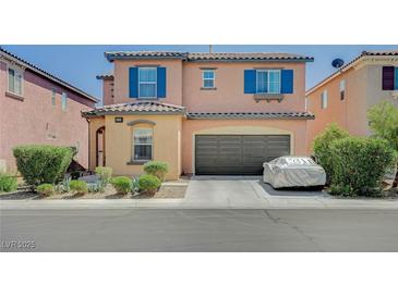 Charming two-story home featuring a two-car garage, manicured landscaping, and great curb appeal at 1413 Miller Ridge Ave, North Las Vegas, NV 89031