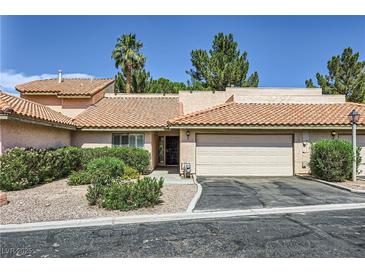 Charming single-story home features a two-car garage and well-maintained desert landscaping at 2708 Campo Verde Dr, Las Vegas, NV 89121