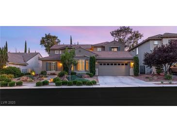 Charming two-story home with a landscaped front yard and a two-car garage at 3535 Coventry Gardens Dr, Las Vegas, NV 89135