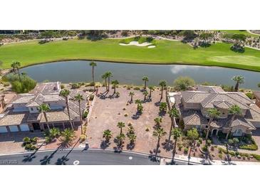 Aerial view of a beautiful vacant lot with golf course and lake views; palm trees dot the property at 38 Grand Miramar Dr, Henderson, NV 89011