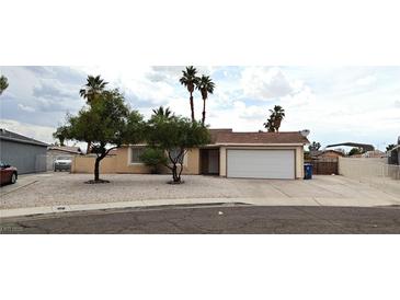 Charming single-story home with a two-car garage and low maintenance landscaping at 275 Las Palmaritas Dr, Las Vegas, NV 89110