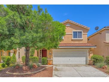 Charming two-story home with a red-tiled roof, large shade tree, and well-maintained landscaping at 3412 Crystal Tower St, Las Vegas, NV 89129