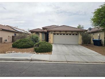 Charming single-story home with a well-maintained front yard and a two-car garage at 9462 Alhambra Valley St, Las Vegas, NV 89178