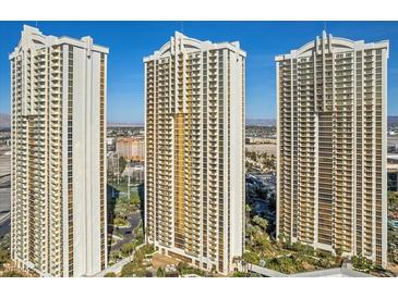 Three high-rise condo buildings featuring a modern design with reflective glass windows and resort style amenities at 135 E Harmon Ave # 3816, Las Vegas, NV 89109