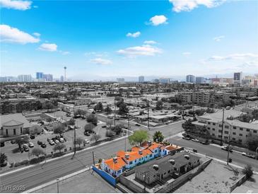 Stunning aerial view of complex with vivid orange tile roofs against Las Vegas skyline at 300 N 14Th St, Las Vegas, NV 89101