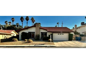 Charming single story home with well-maintained landscaping and a two car garage at 3729 La Junta Dr, Las Vegas, NV 89120