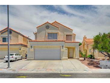 Charming two-story home featuring a two-car garage and neutral stucco finish with a lovely red tile roof at 420 Clifton Heights Dr, Las Vegas, NV 89145