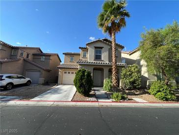 Two-story home with an attached garage, complemented by a palm tree and front yard landscaping at 4749 Golden Shimmer Ave, Las Vegas, NV 89139