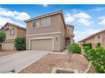 Charming two-story home with a well-maintained front yard and two-car garage at 6108 Shallow Springs St, Las Vegas, NV 89130