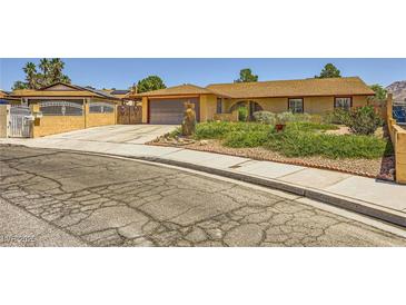 Charming single-story home with a well-maintained front yard and inviting curb appeal at 1950 Abarth St, Las Vegas, NV 89142
