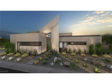 Stunning modern home with desert landscaping, unique architectural design, and elegant exterior lighting at 3530 Cosima Ln, Las Vegas, NV 89120
