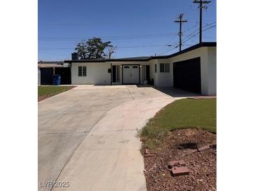 Charming single-story home with a spacious driveway and well-maintained front yard at 3900 San Angelo Ave, Las Vegas, NV 89102