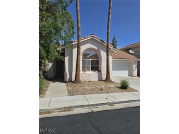 Charming single-story home featuring desert landscaping and a well-maintained front yard at 79 Magical Mystery Ln, Henderson, NV 89074